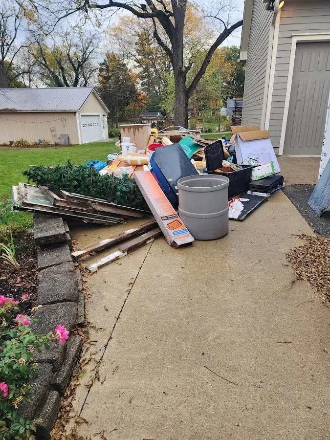 Dumpster being loaded with debris for 3 Yard Dumpster Rental in Helena Valley Northeast